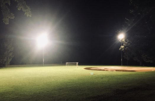 rainy field, lights on, hunnewell field